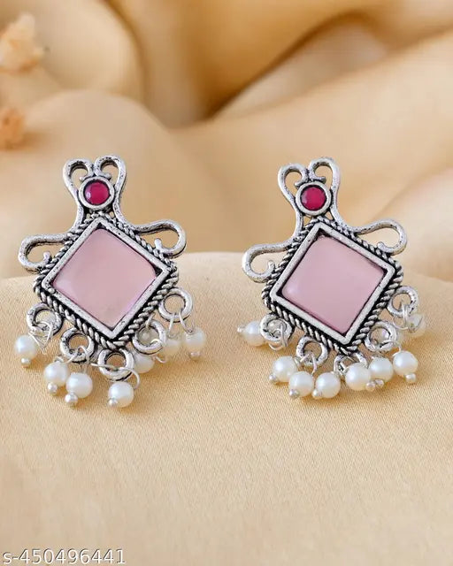 This collection features four stylish oxidized silver earrings: two pairs of elegant studs and vibrant pink and turquoise studs. Perfect for the office, kitty parties, and small occasions, these earrings add a chic touch to any outfit!